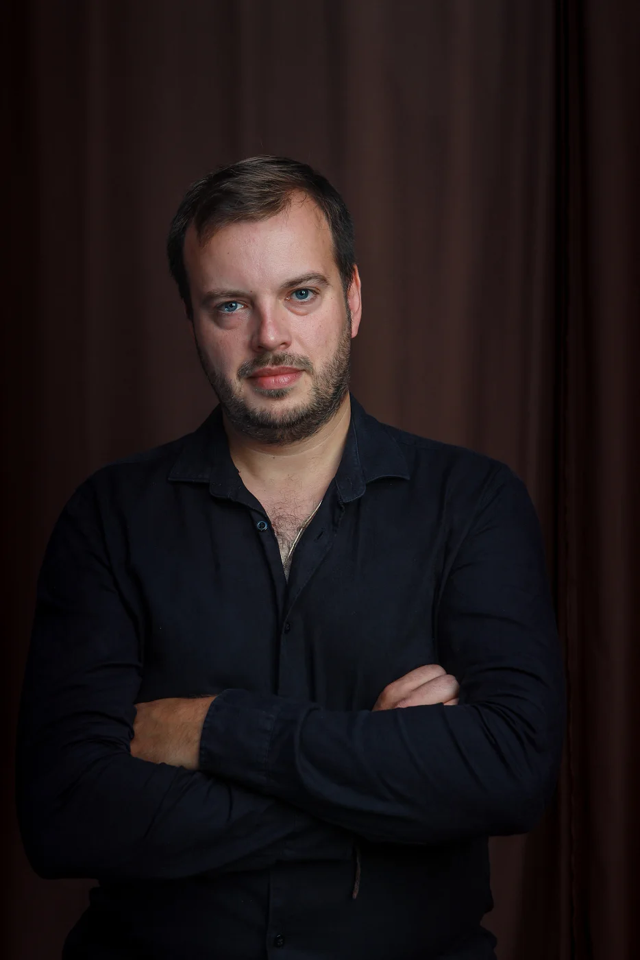 Portrait of Jiří Kabát with arms crossed
