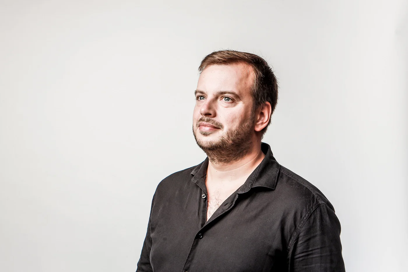 Profile portrait of Jiří Kabát against a light background