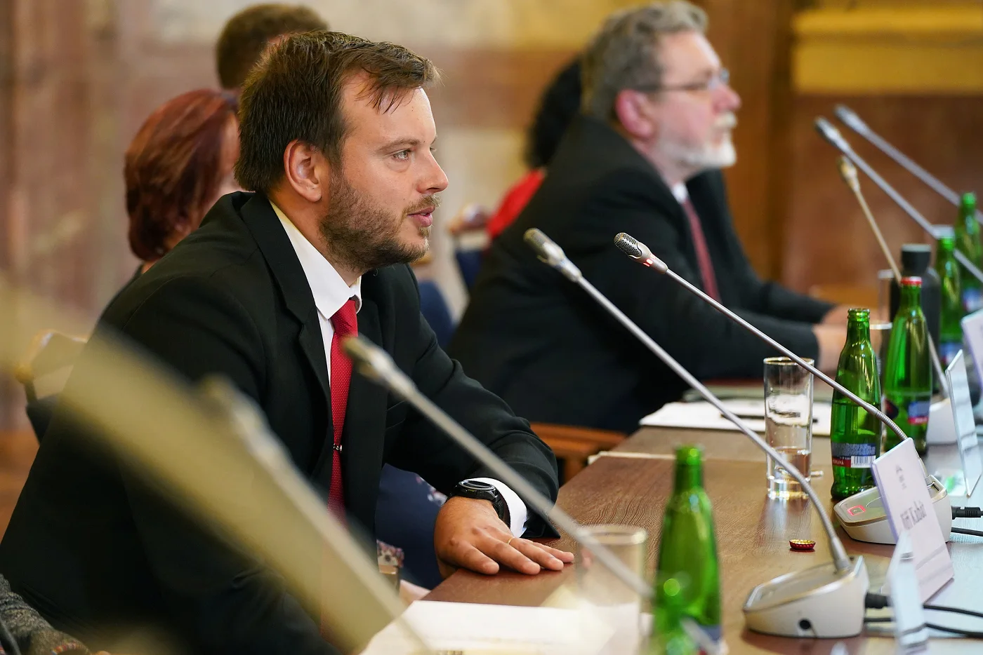 Jiří Kabát at a table with microphones
