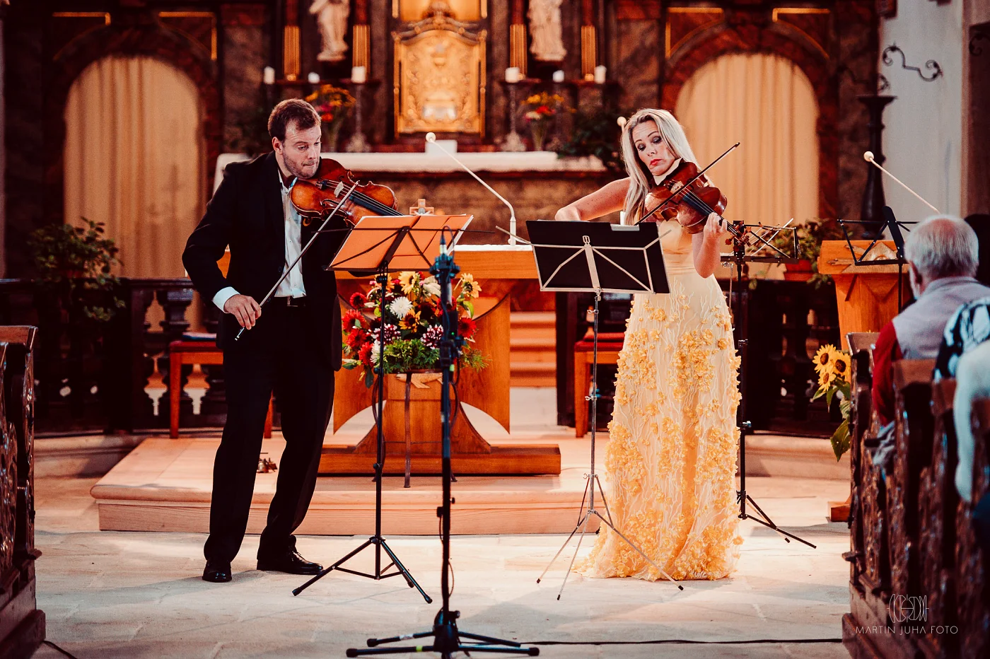 Jiří Kabát and a violinist at a concert in a church